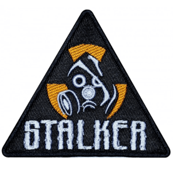 Triangular embroidered patch with gas mask and hazard emblem design, inspired by the S.T.A.L.K.E.R. game series.
