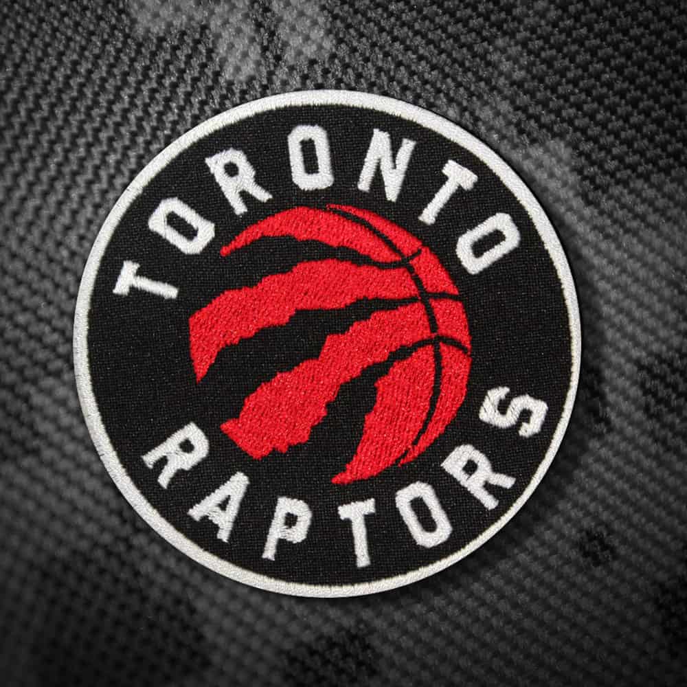 Close-up of an intricately embroidered NBA Raptors patch.