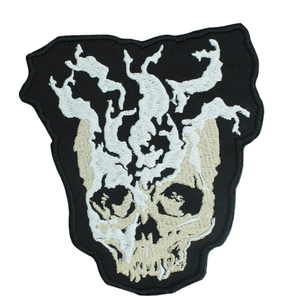 Detailed embroidered patch of Bloodborne's Madman's Knowledge with skull and swirling designs.