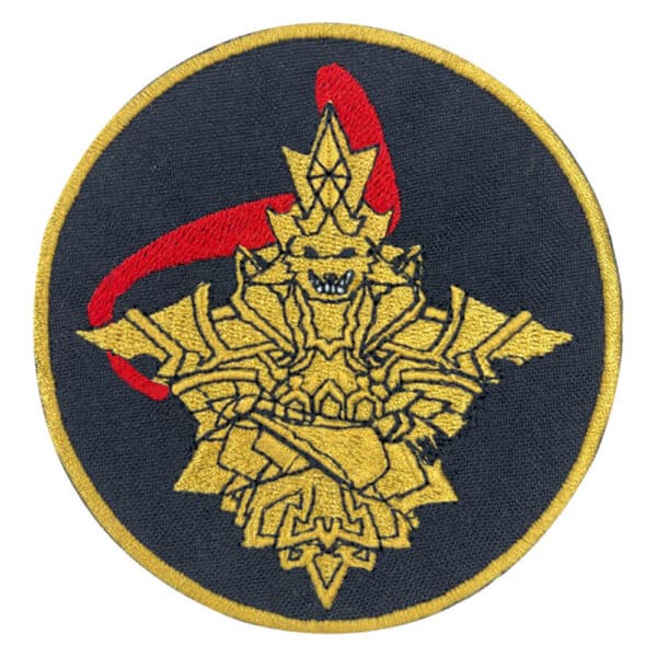 Dragon Slayer Ornstein embroidered patch with yellow armor design on a black circular background with a red accent.