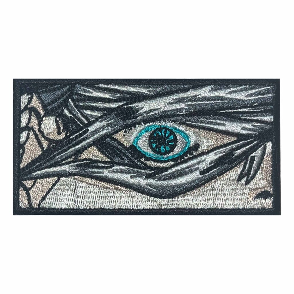 Embroidered Satoru Gojo Patch featuring Gojo’s iconic Six Eyes from Jujutsu Kaisen. The patch showcases his piercing blue eye as he lifts his blindfold. Perfect for Jujutsu Kaisen anime and manga fans, cosplay, and collectors.